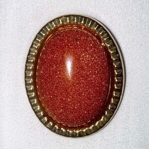 Vintage goldstone and brass brooch/pendant with optional clasp for necklace.